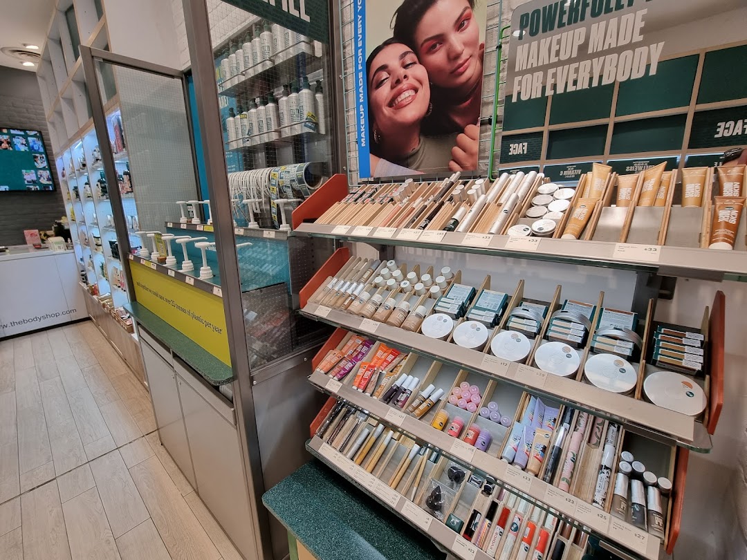 An interior view of The Body Shop, showcasing makeup, skincare products, and a 'Makeup Made for Everybody' display.