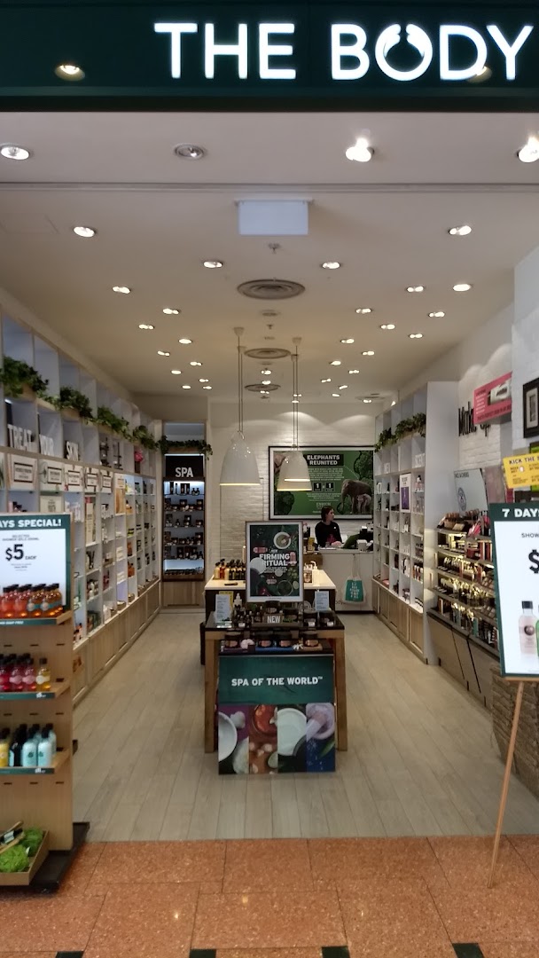 The entrance of The Body Shop, showcasing its inviting interior with beauty and skincare products.