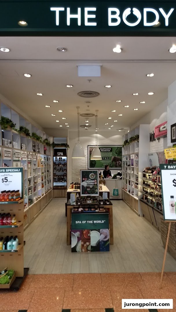 The entrance of The Body Shop, showcasing its inviting interior with beauty and skincare products.