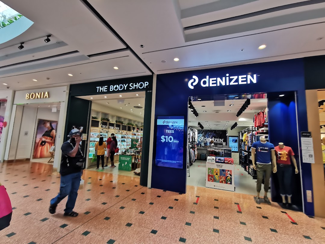 View of The Body Shop and Denizen storefronts within a bustling shopping mall.