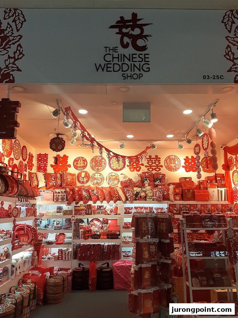 The shopfront of The Chinese Wedding Shop, showcasing a vibrant display of traditional red wedding items.