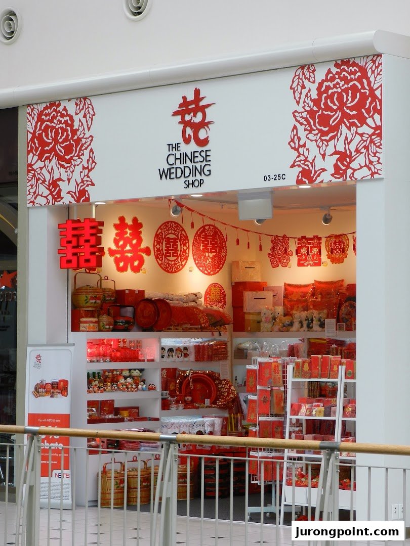 The storefront of The Chinese Wedding Shop, adorned with traditional red decorations and wedding essentials.