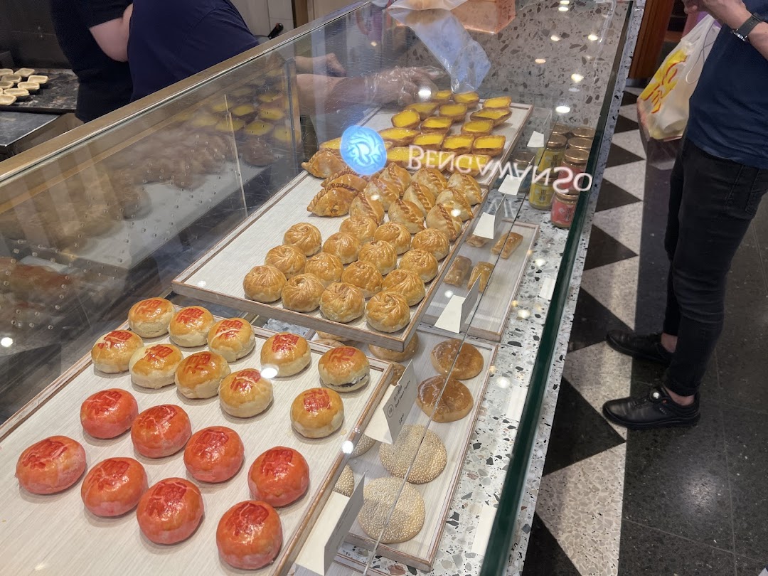 A display case at Tong Heng filled with a variety of traditional Chinese pastries and baked goods.