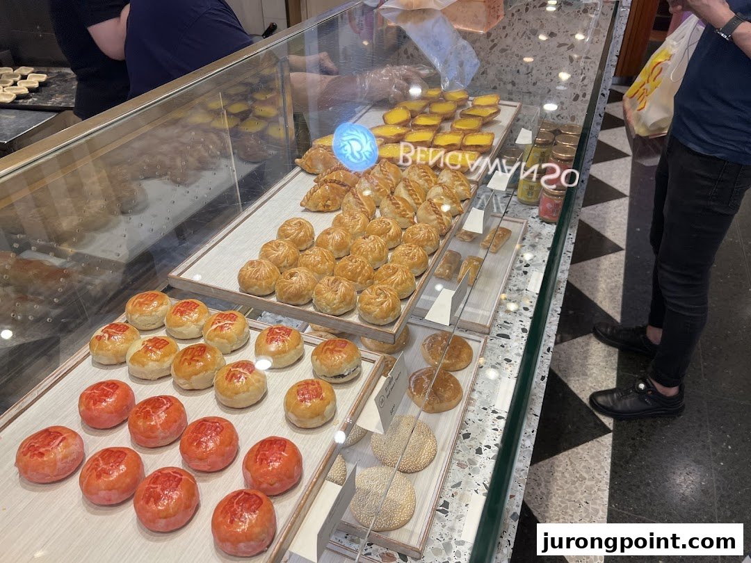 A display case at Tong Heng filled with a variety of traditional Chinese pastries and baked goods.