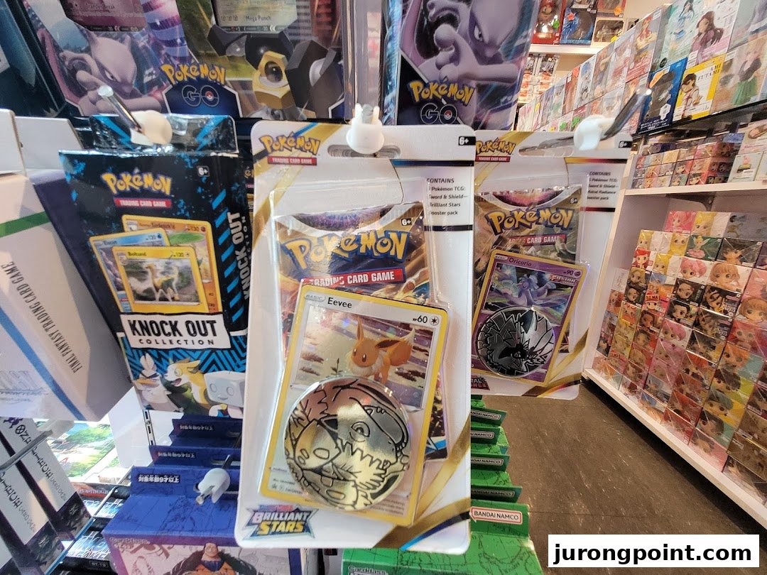 A vibrant display of Pokémon Trading Card Game products, including booster packs and special collections, within a retail store.
