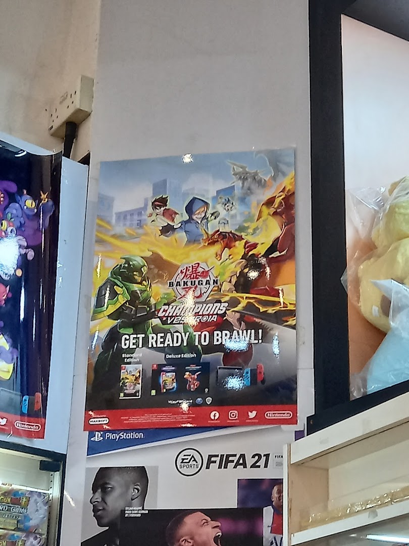 An interior shot of Toy Or Game TOG, featuring vibrant posters for Bakugan and FIFA 21 games.