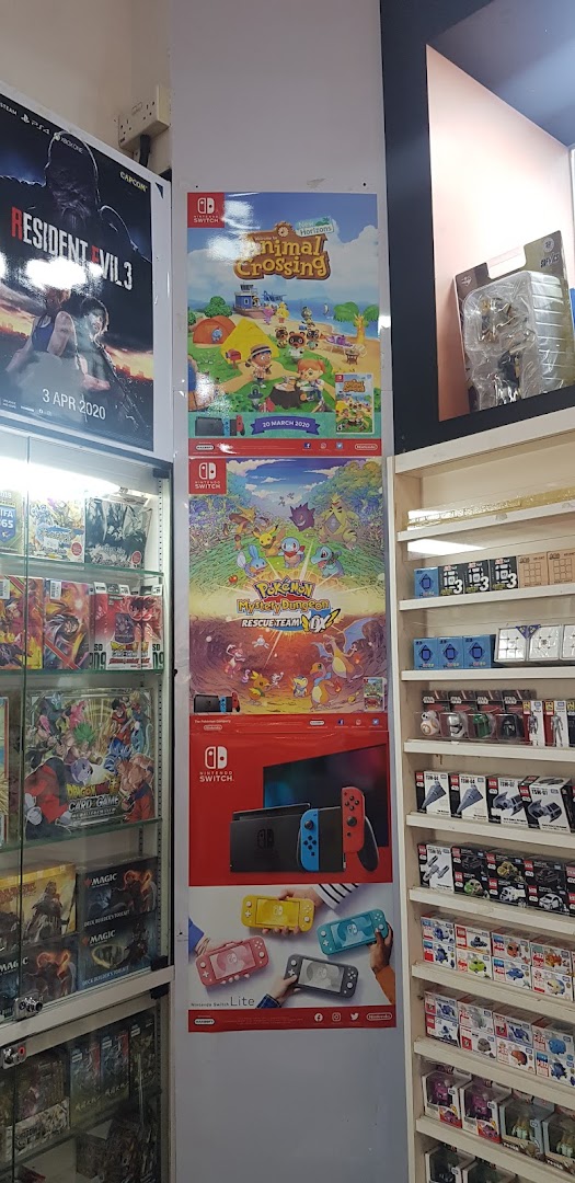 Interior view of a game and toy shop featuring video game posters, consoles, and various collectibles.