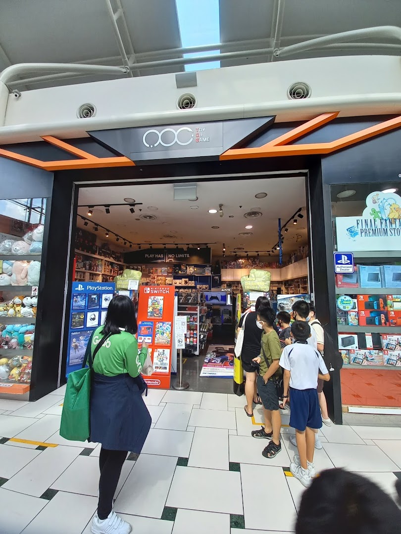 The shop front of Toy Or Game (TOG) with customers queuing to enter, showcasing gaming consoles and merchandise.