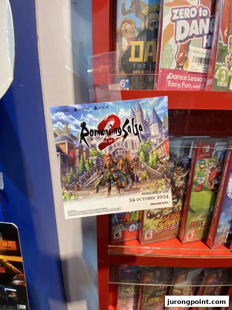 A display shelf at Toy Or Game TOG featuring various video games and a Romancing SaGa 2 poster.