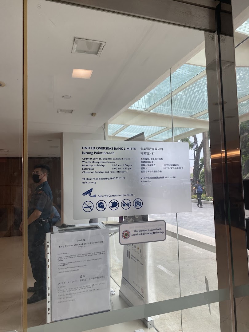 The entrance of UOB Jurong Point Branch displaying operating hours and notices.