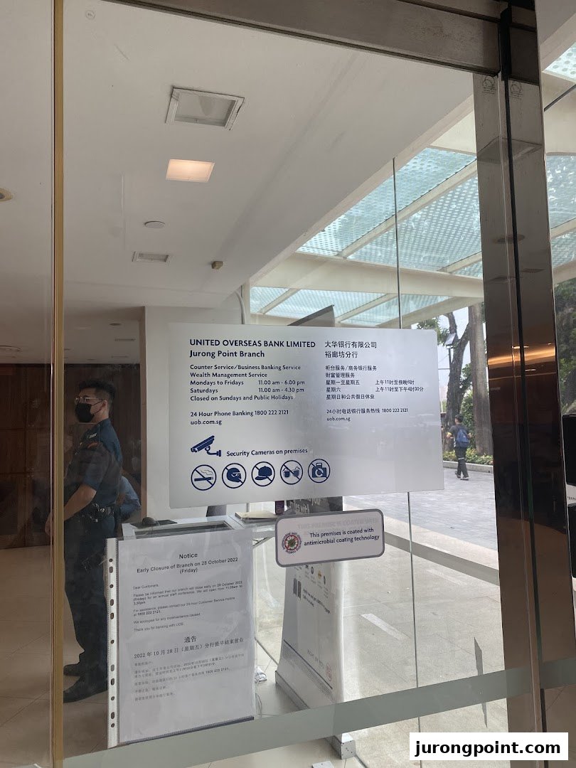 The entrance of UOB Jurong Point Branch displaying operating hours and notices.
