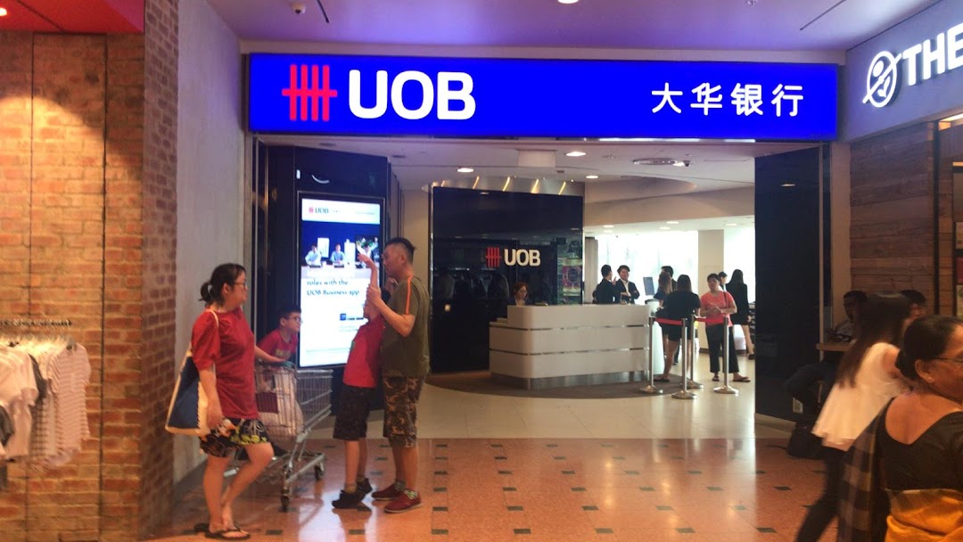 The UOB bank branch entrance at Jurong Point, with customers inside and outside.