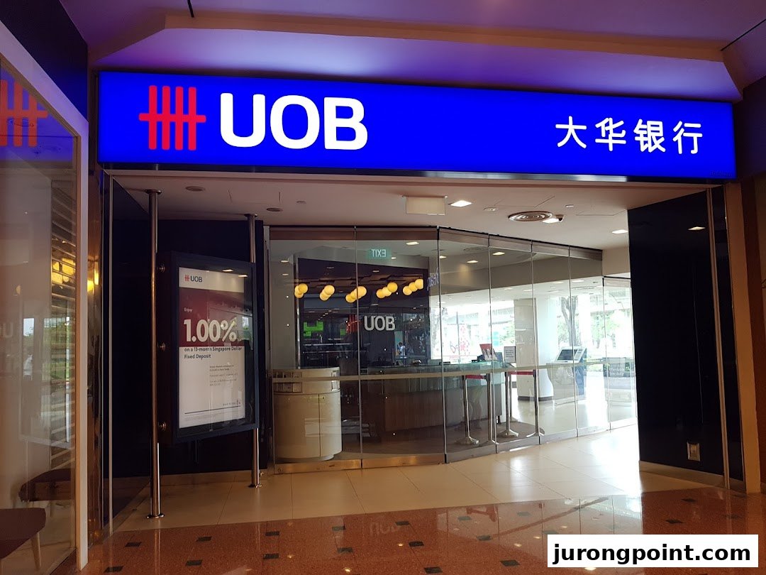 The illuminated UOB bank sign and glass entrance of the Jurong Point branch are visible.