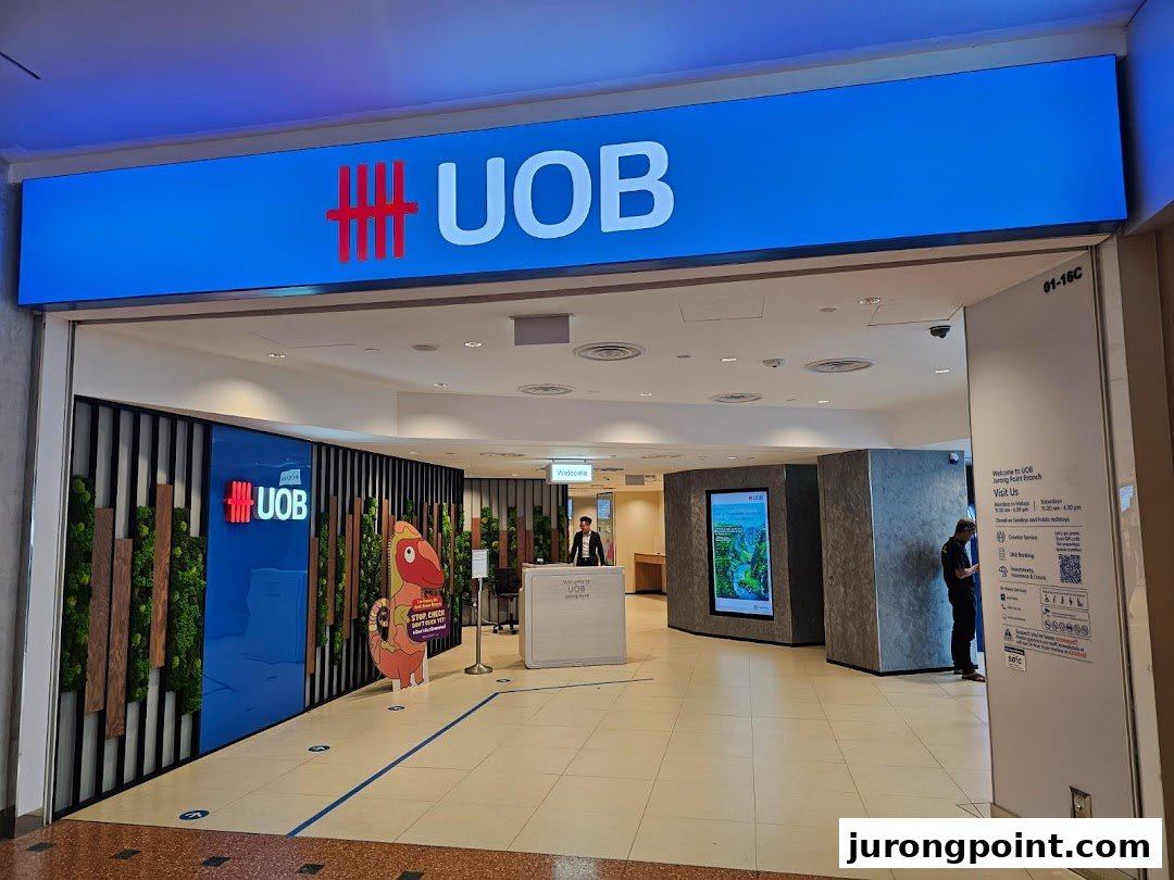 The entrance of UOB Jurong Point Branch, featuring a prominent blue sign and modern interior design.