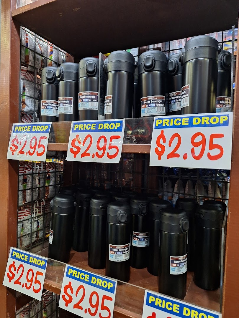 Shelves display black thermal bottles on sale for $2.95, designed to keep beverages hot or cold.