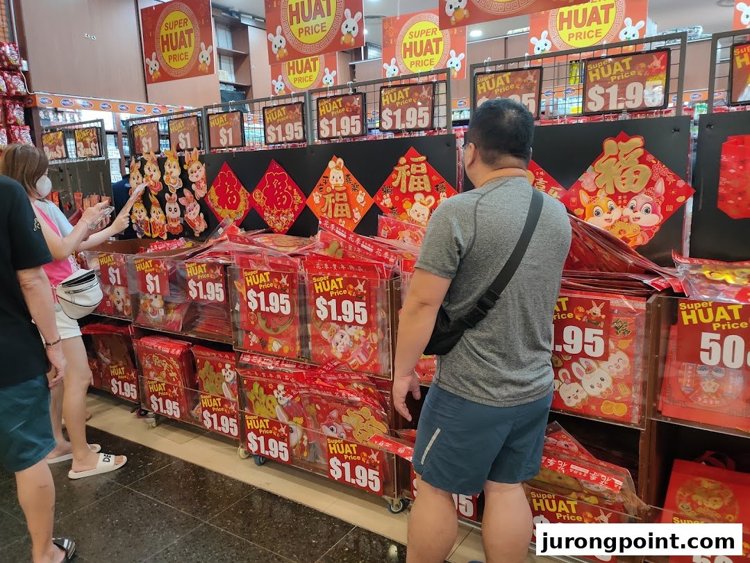 Customers browse vibrant Chinese New Year decorations and festive items at Valu.