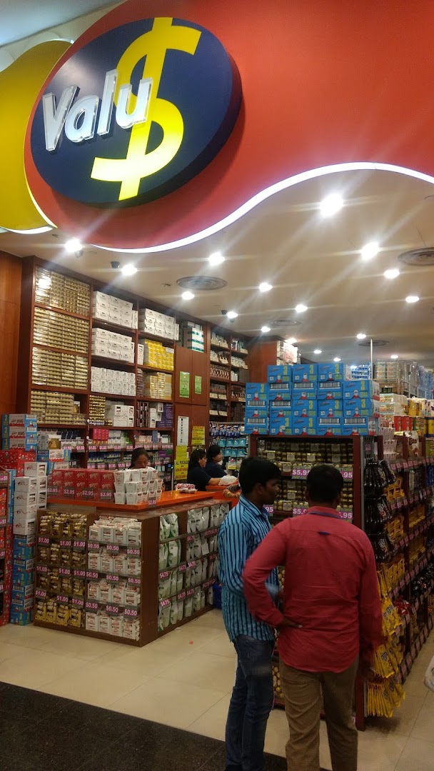 Interior view of Valu store, showcasing diverse products, shelves, and customers shopping.