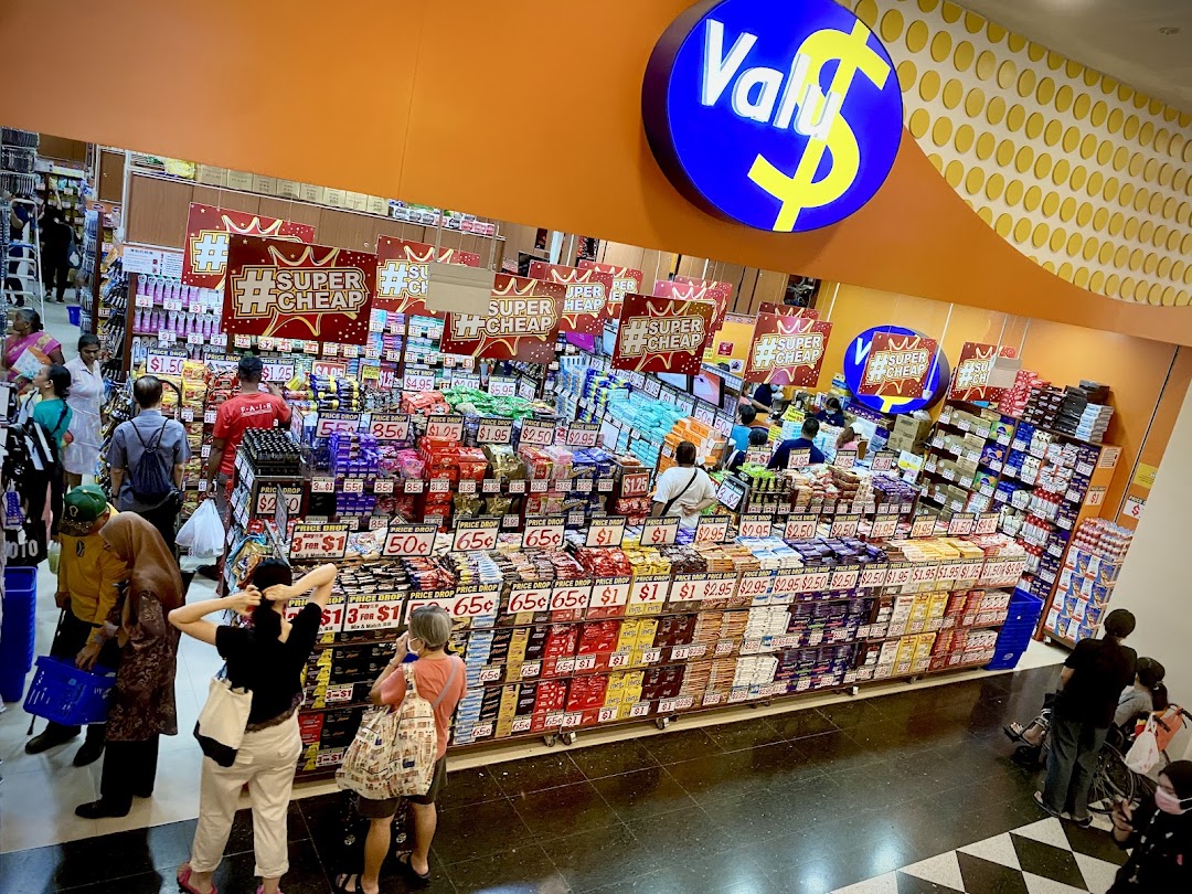 A bustling interior view of Valu, a discount store, showcasing a wide array of products and shoppers.