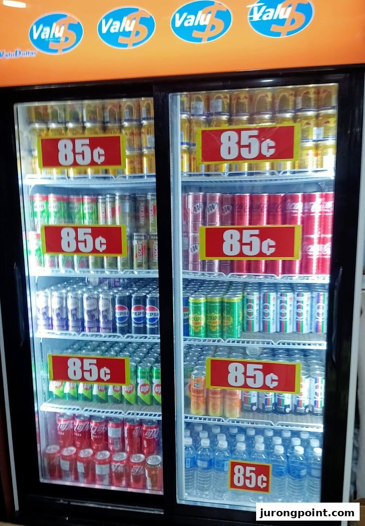 A refrigerated display case filled with various beverages, prominently priced at 85 cents.
