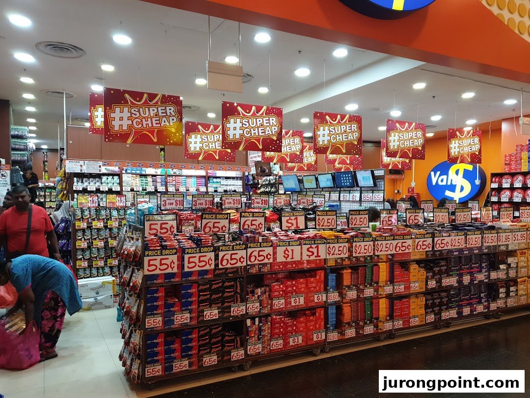 Entrance of Valu discount store featuring numerous products and 'Super Cheap' promotions.