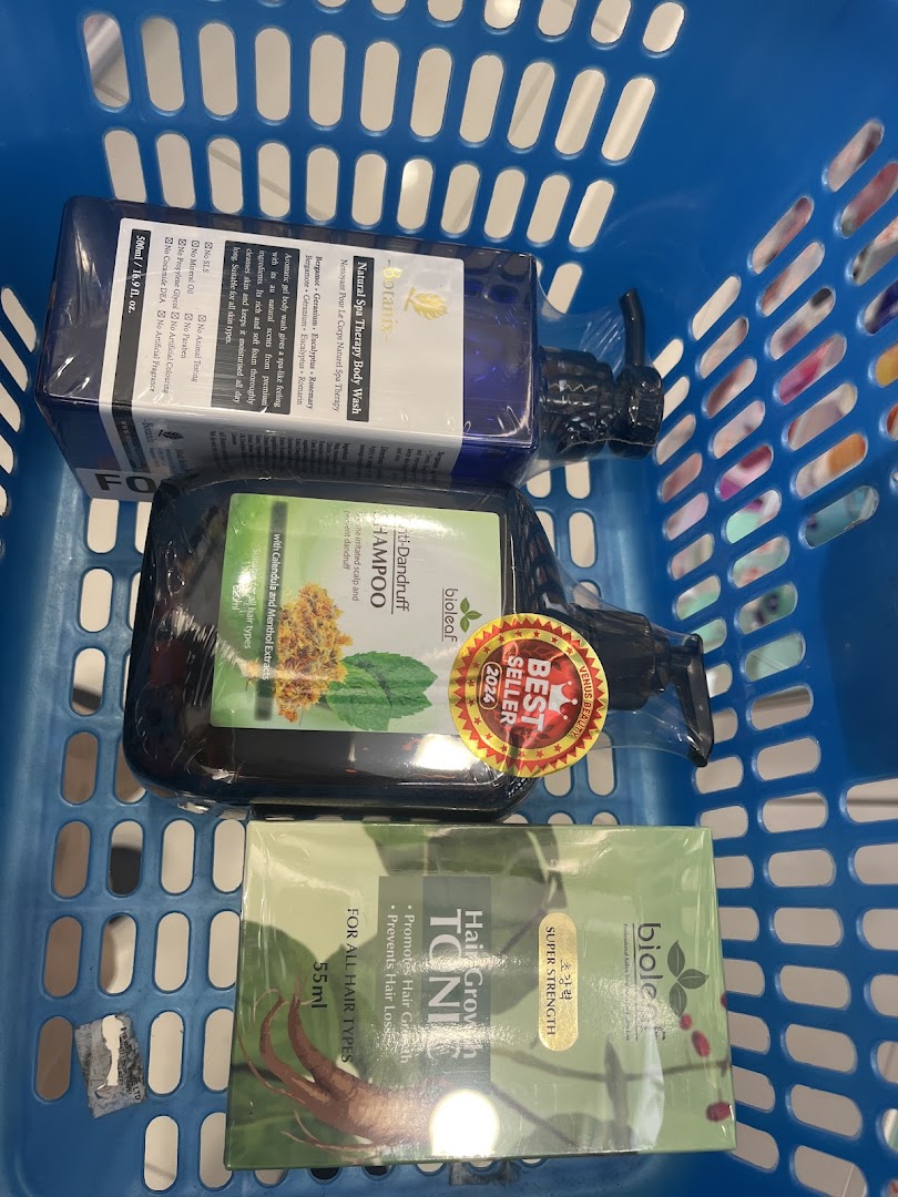 A blue shopping basket filled with beauty and hair care products from Venus Beauty.