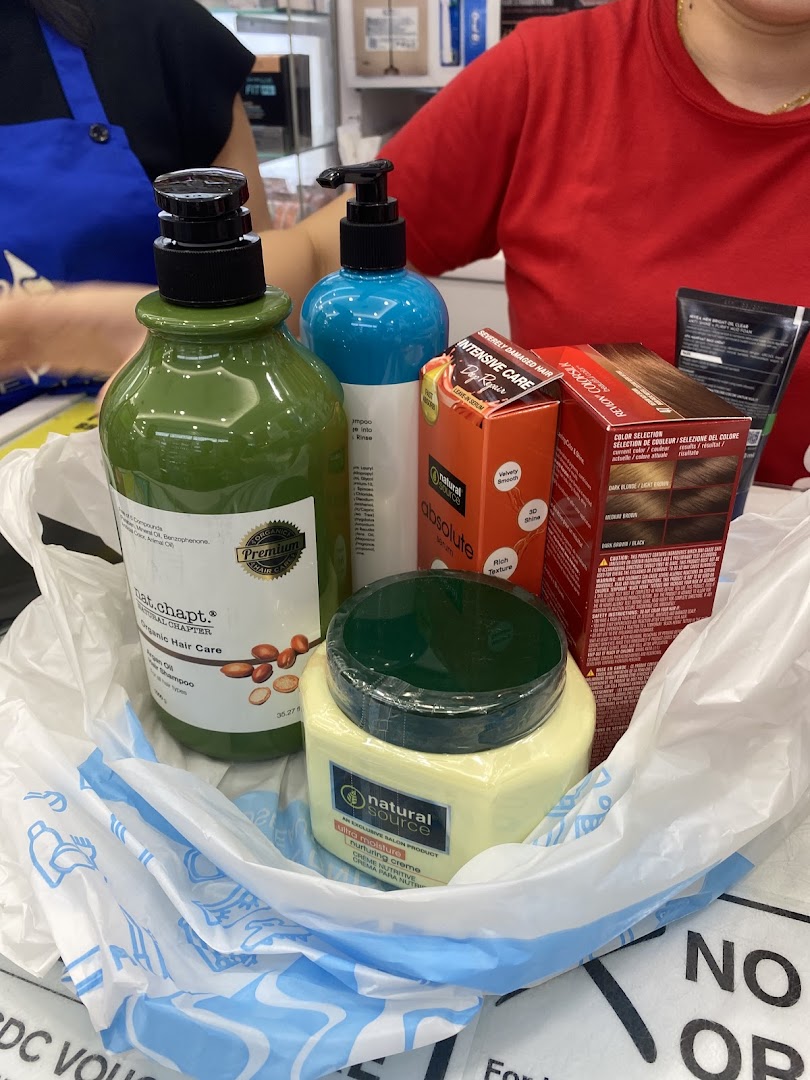 A shopping bag filled with various hair care and beauty products from Venus Beauty.