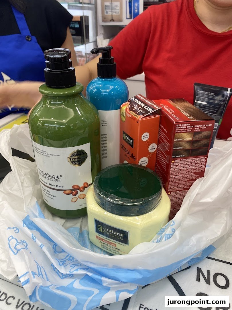 A shopping bag filled with various hair care and beauty products from Venus Beauty.