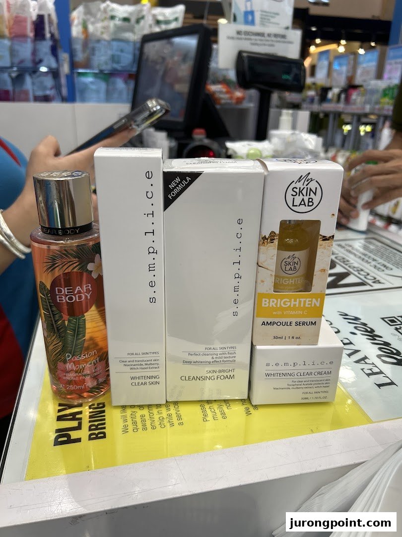 A display of various beauty and skincare products, including serums, cleansers, and body mist.