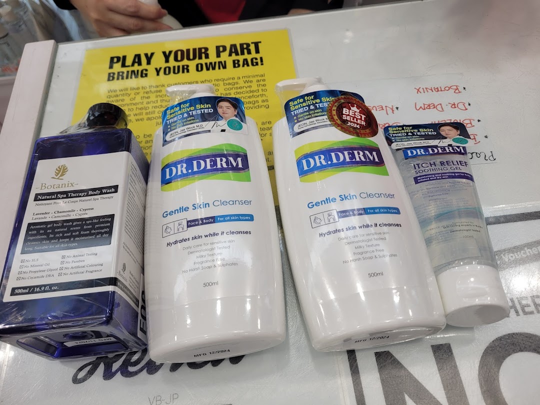 A close-up of various skincare and body care products, including cleansers and body wash, displayed on a counter.
