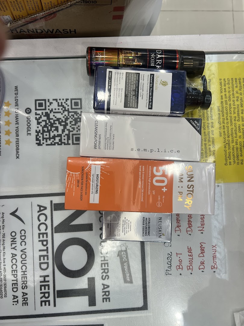 A close-up of various skincare and beauty products, including cleansers, body wash, and sunscreen, displayed on a counter.