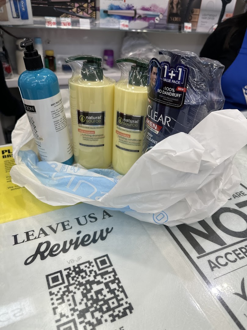 A shopping bag filled with hair care products, including shampoo and conditioner, with a QR code for customer reviews.