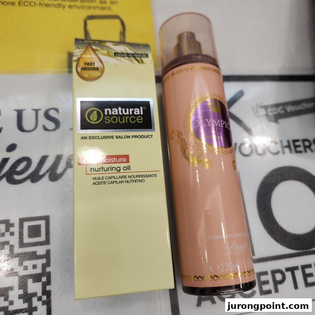 Close-up of two beauty products: Natural Source Nurturing Oil and an Olympic fragrance body spray.