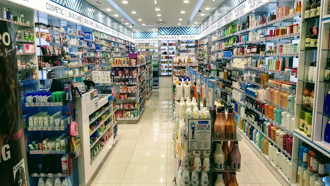 A well-lit interior view of Venus Beauty, showcasing extensive aisles of beauty and personal care products.
