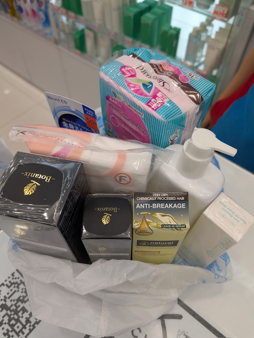 A shopping bag filled with various beauty and personal care products from Venus Beauty.