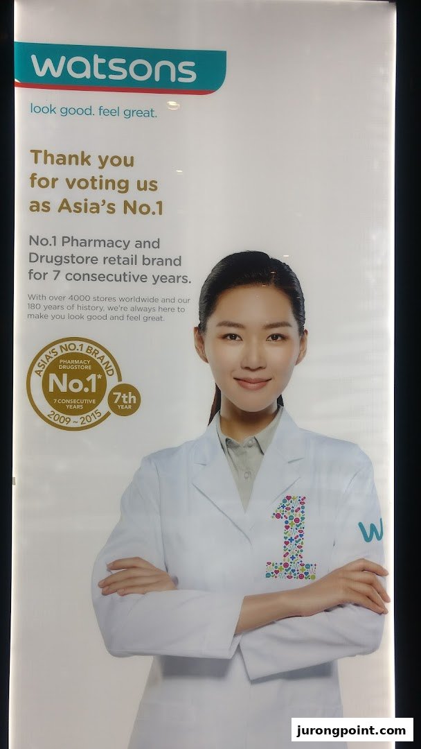 A Watsons promotional poster featuring a woman in a lab coat and highlighting their 'Asia's No.1' status.