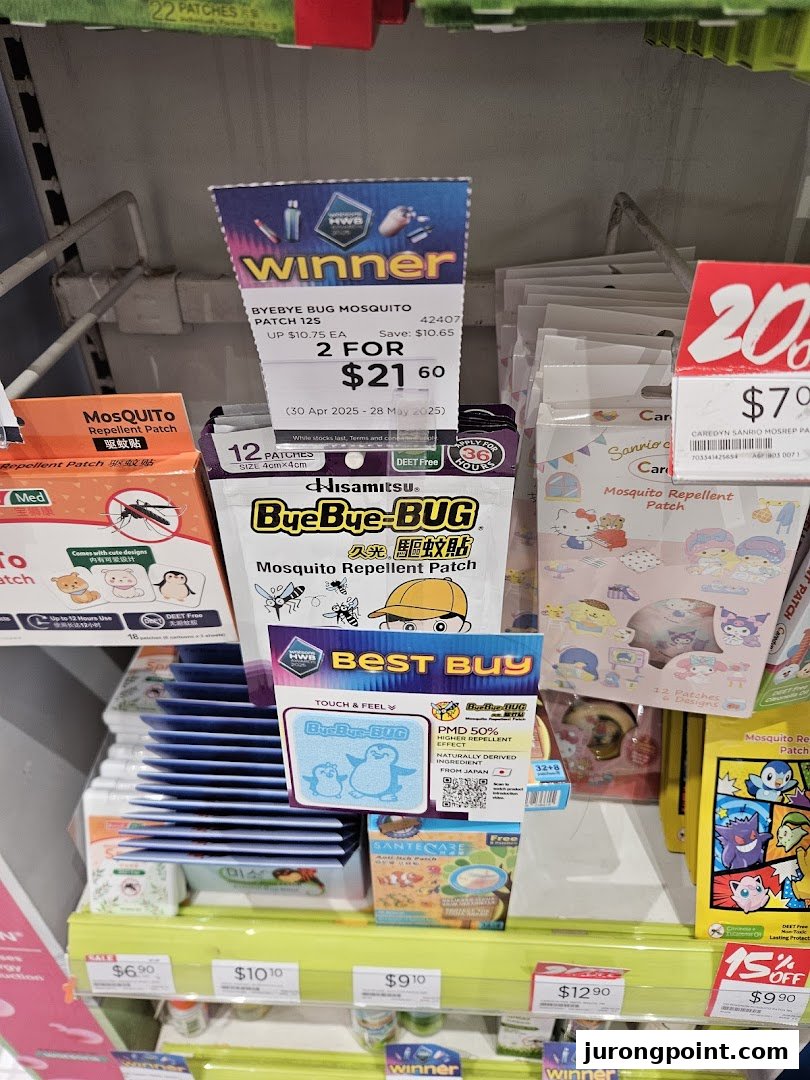 A retail display featuring various mosquito repellent patches and health products inside a pharmacy.