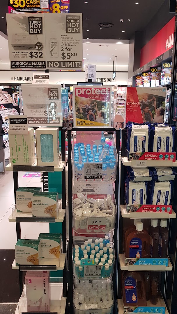 A Watsons store display featuring health and hygiene essentials like masks, hand sanitizers, and alcohol swabs.