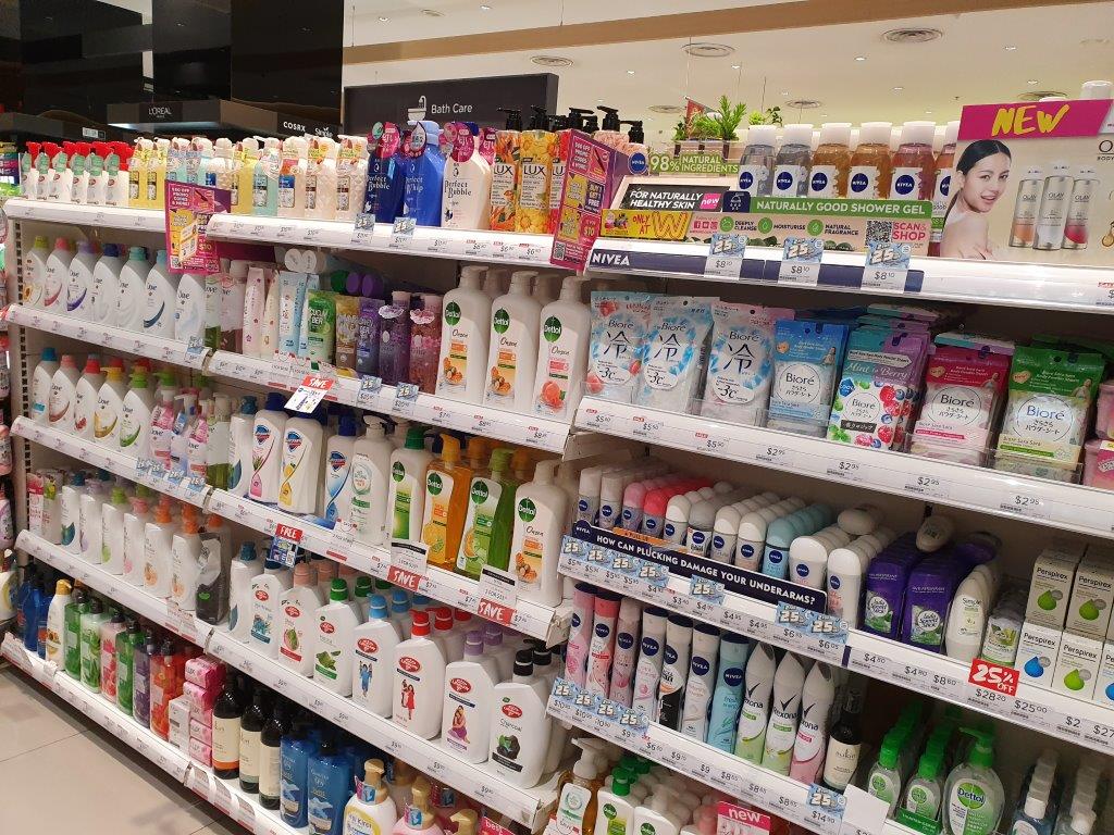 Shelves stocked with a wide variety of personal care products, including shampoos, body washes, and deodorants.