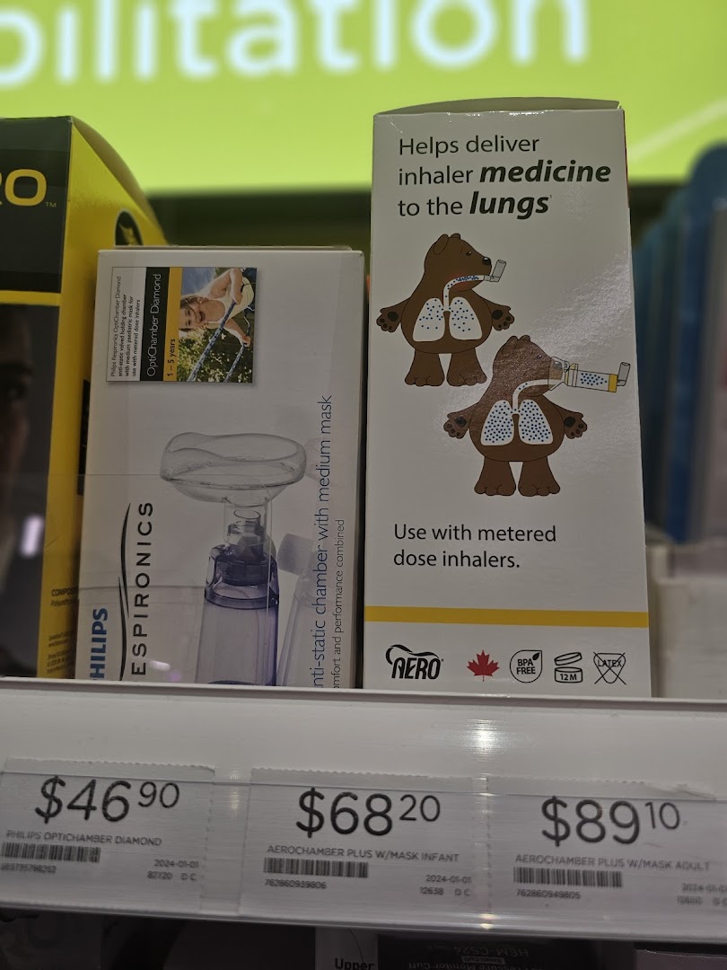 Close-up of medical devices and their prices on a pharmacy shelf.