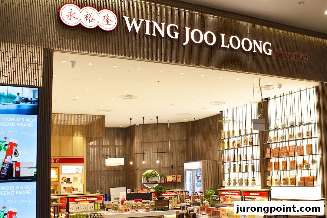 The storefront of Wing Joo Loong, a traditional remedies shop, showcasing its illuminated sign and interior products.