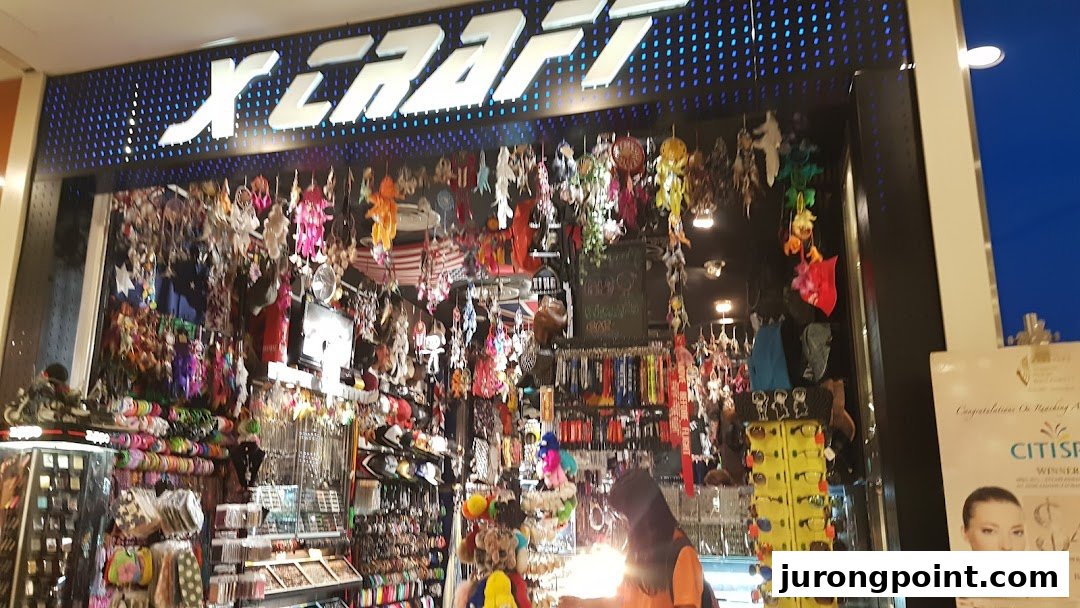 The brightly lit entrance of X-Craft, showcasing a wide array of accessories and novelty items.