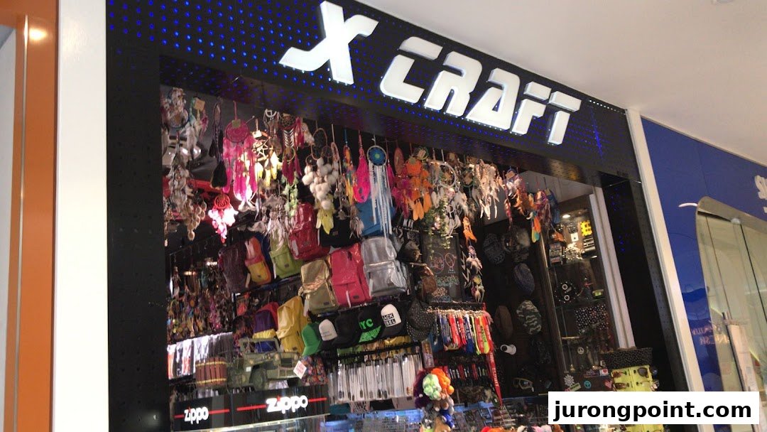 The X-Craft shop front displays a wide array of accessories, bags, and dreamcatchers.