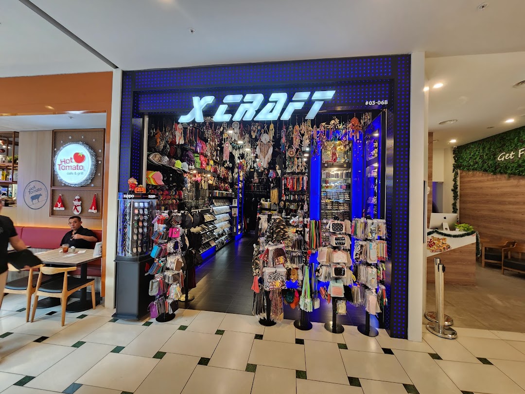 The brightly lit entrance of X-Craft, showcasing a wide array of accessories and unique gifts.
