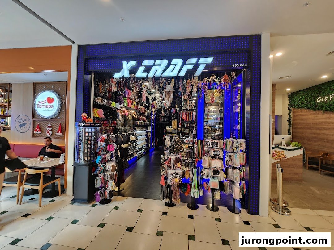 The brightly lit entrance of X-Craft, showcasing a wide array of accessories and unique gifts.