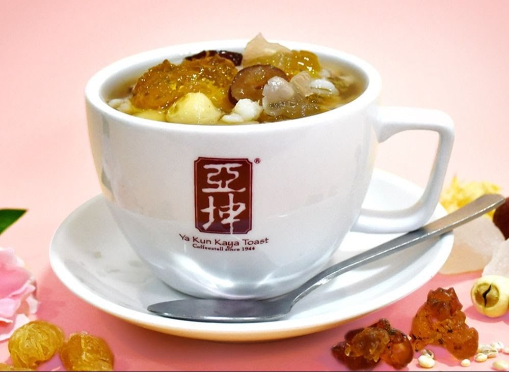 A close-up of a delicious traditional dessert served in a white cup from Ya Kun Family Cafe.