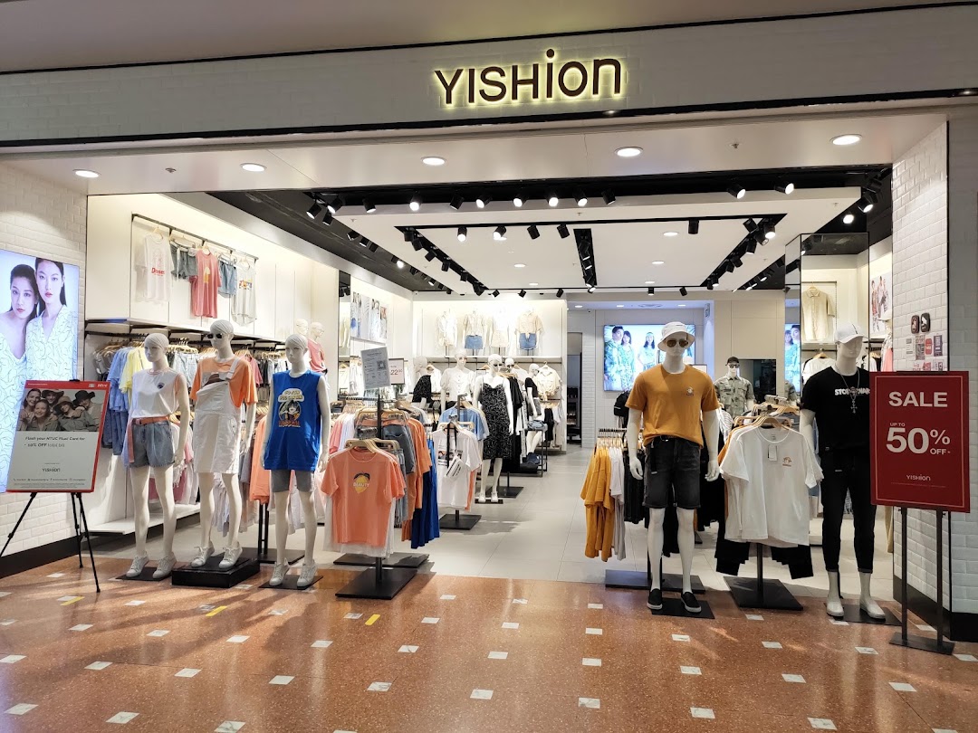 The YISHION shop front displays trendy apparel on mannequins, featuring a prominent sale sign.