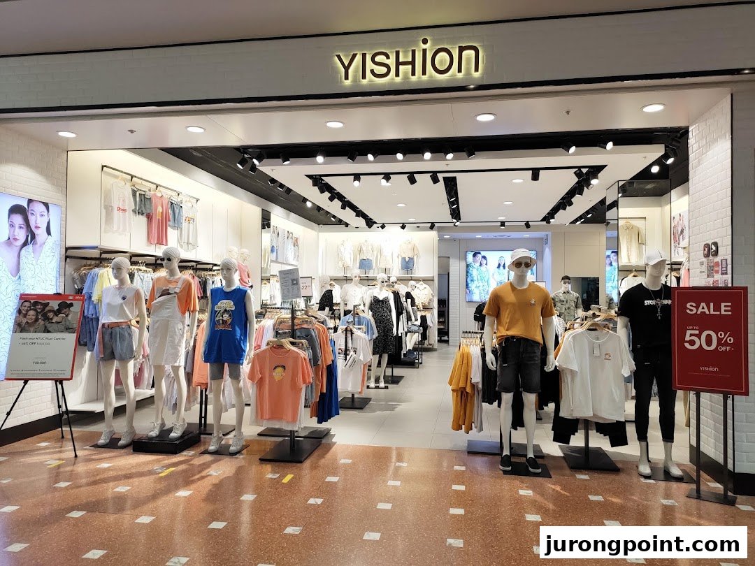 The YISHION shop front displays trendy apparel on mannequins, featuring a prominent sale sign.
