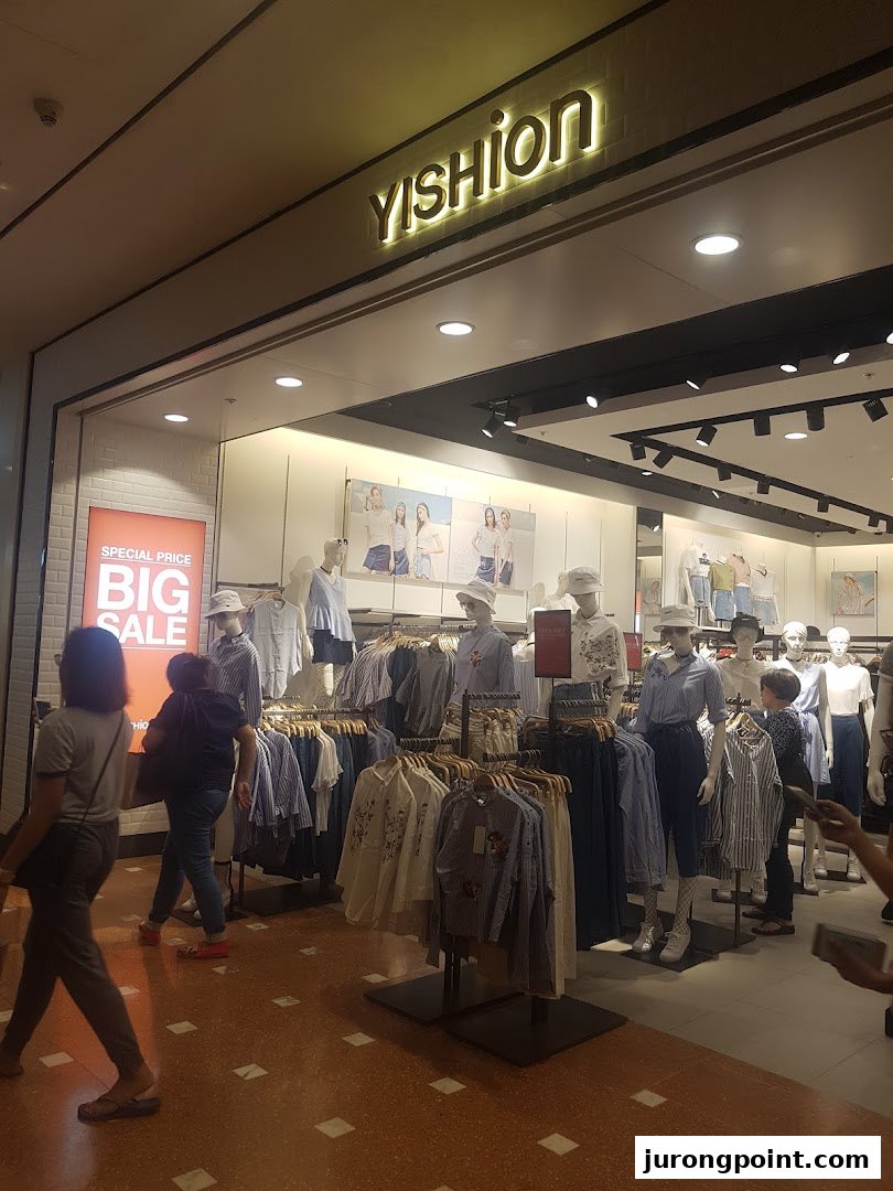 The YISHION shop front features mannequins displaying trendy apparel and a 'BIG SALE' sign.