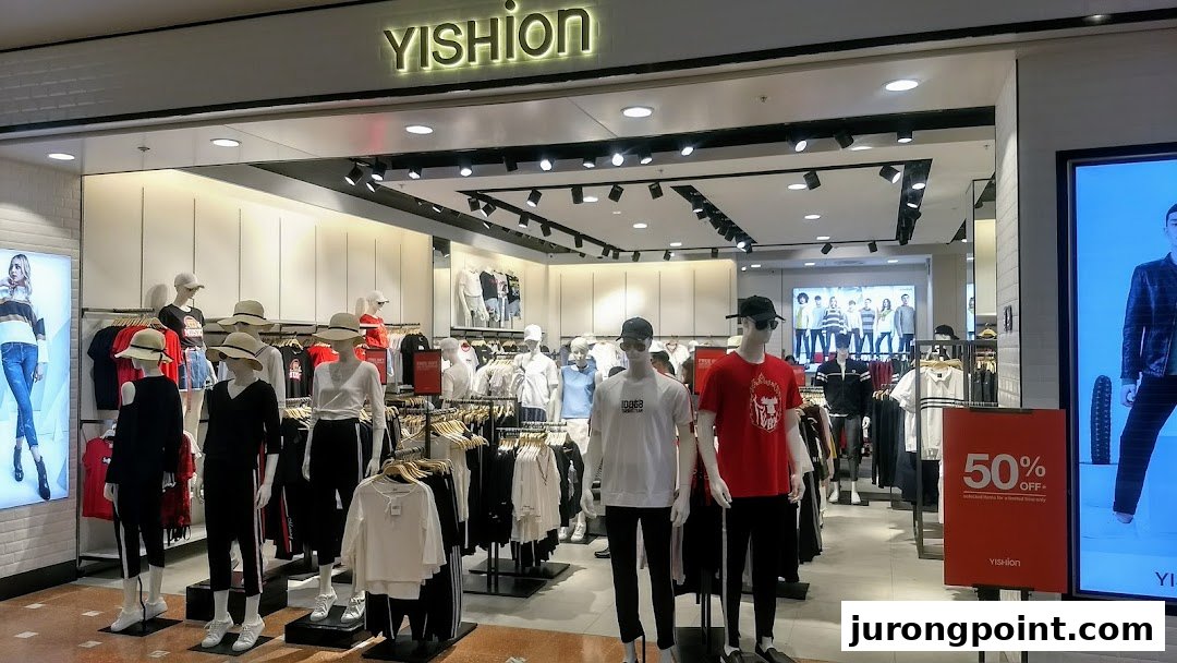 The storefront of YISHION, a fashion retailer, showcasing trendy apparel on mannequins and a 50% off promotion.