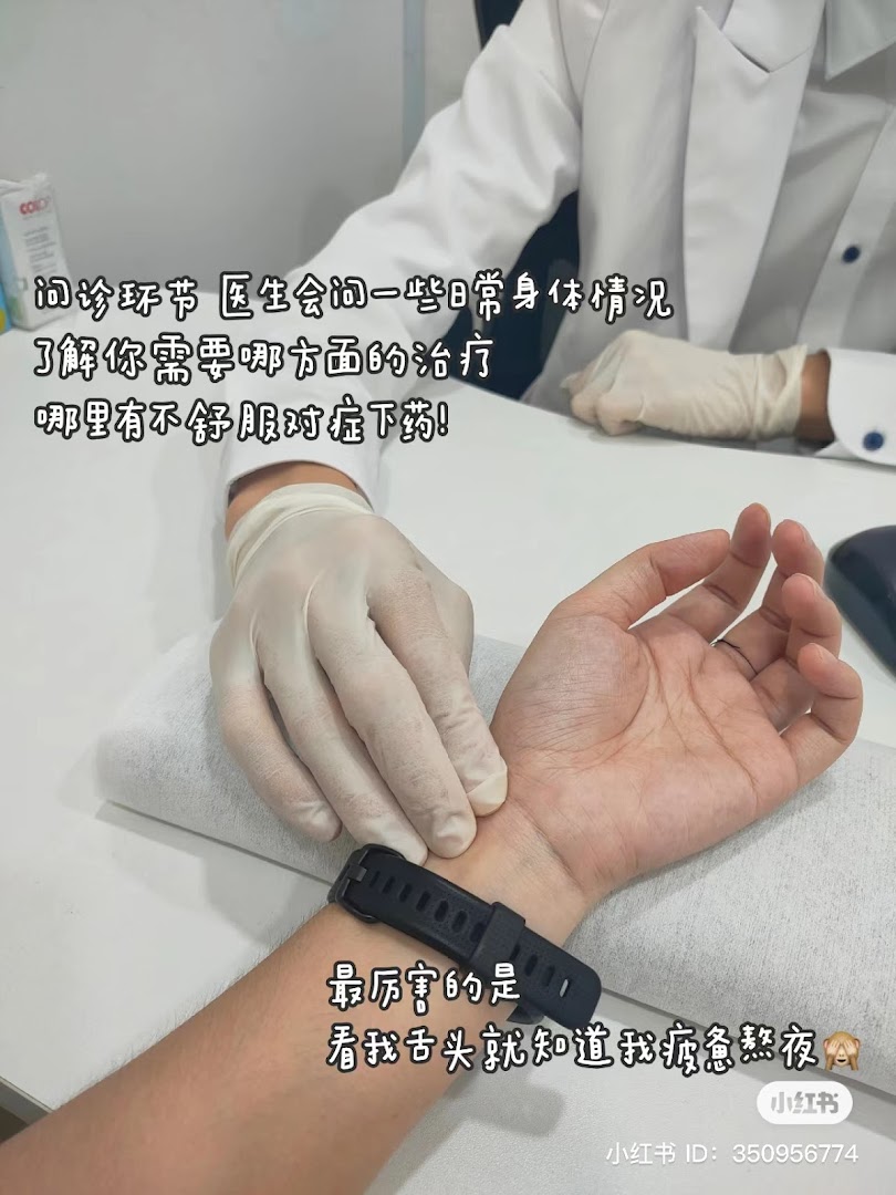A Traditional Chinese Medicine (TCM) doctor performs pulse diagnosis on a patient's wrist.